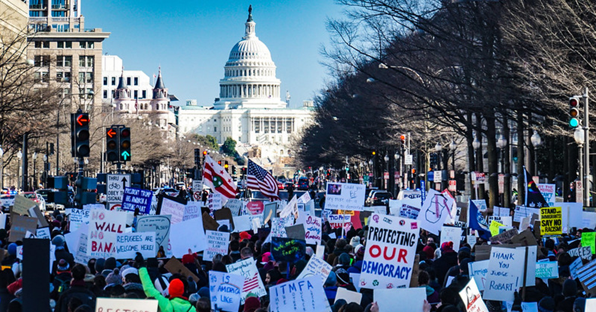 Yes on HR-1 and HR-4 Photo of rally on Capitol Hill. Restore our democracy - Yes on HR-1 and HR-4.